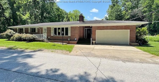 1526 Trace Fork Rd, South Charleston, WV 25309 - single story home with driveway, an attached garage, a chimney, a front lawn, and brick siding
