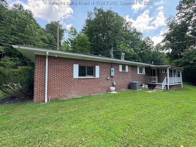 1526 Trace Fork Rd, South Charleston, WV 25309 - rear view of property with a porch, a yard, and brick siding