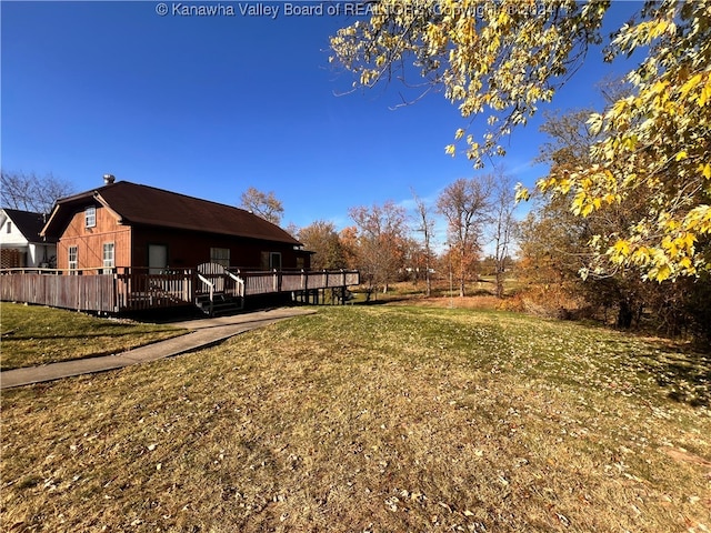 view of yard with a wooden deck