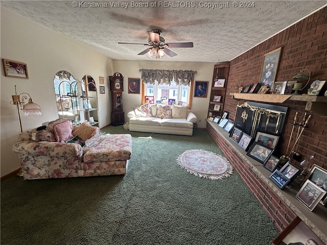 living room with ceiling fan, a textured ceiling, carpet floors, and a brick fireplace