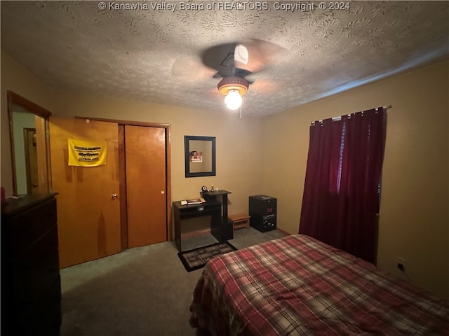 bedroom with light carpet, a closet, a textured ceiling, and ceiling fan