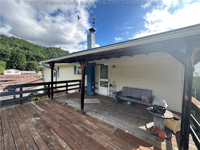 wooden deck featuring area for grilling