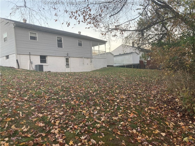 back of house featuring central AC