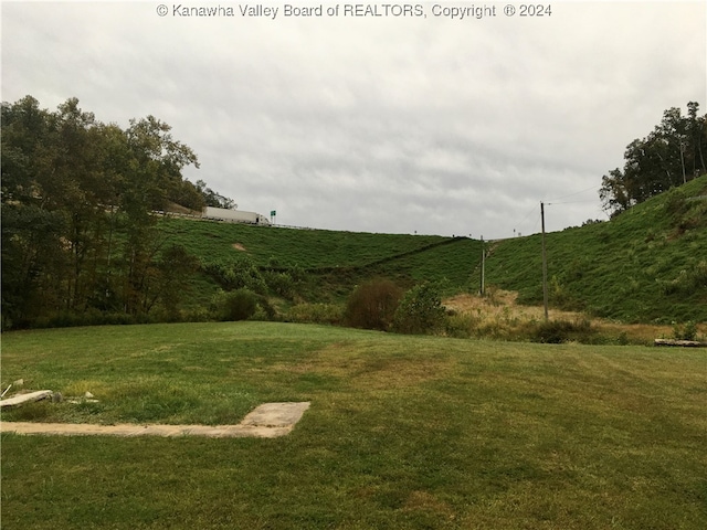 view of yard with a rural view