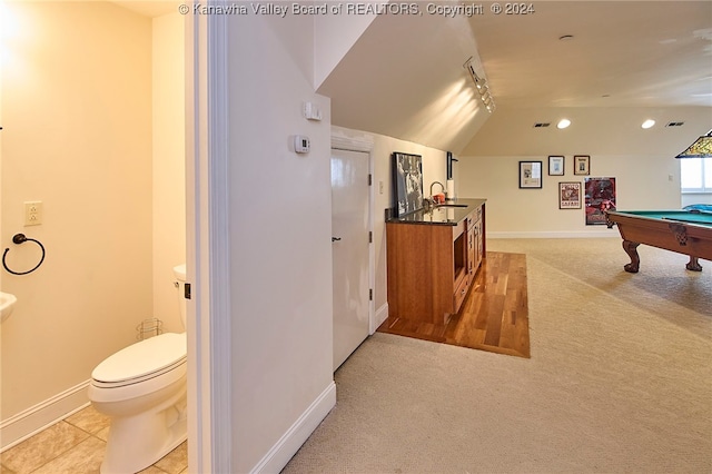 game room with sink, vaulted ceiling, light carpet, and billiards