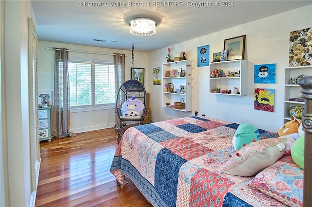 bedroom with hardwood / wood-style flooring