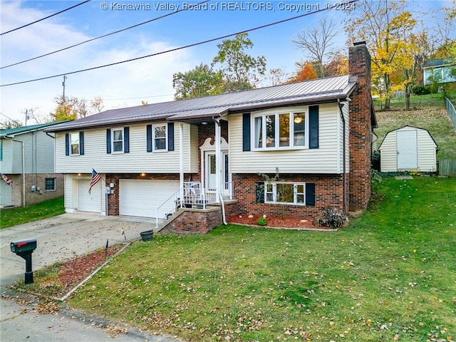 bi-level home featuring a garage, a front yard, and a storage shed