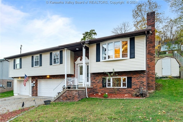 split foyer home with a garage, a front yard, and a shed