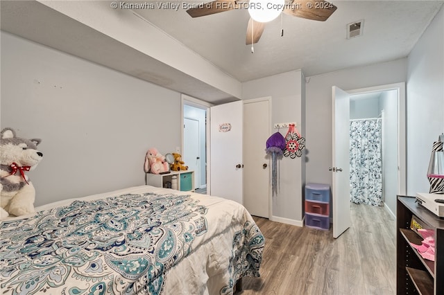 bedroom with wood-type flooring and ceiling fan