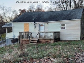 back of property featuring a wooden deck