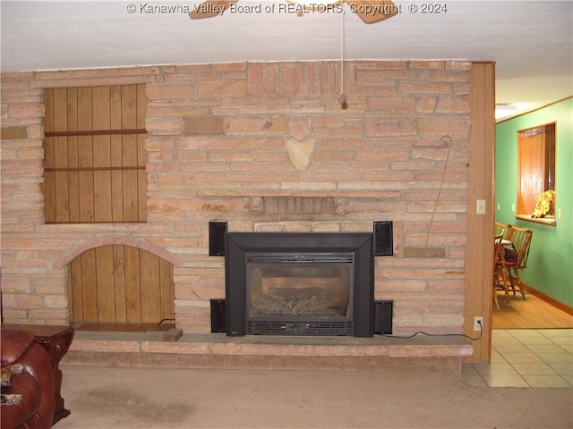 room details with hardwood / wood-style floors and a fireplace