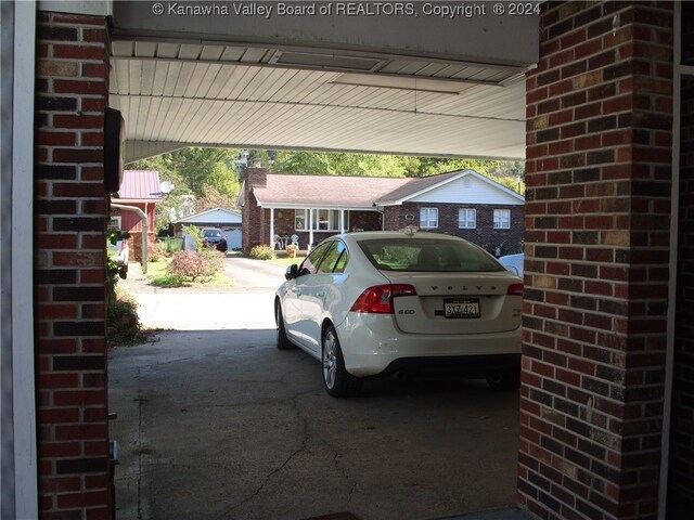 view of parking featuring a carport