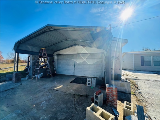 garage featuring a carport