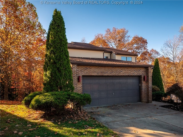 view of side of property featuring a garage