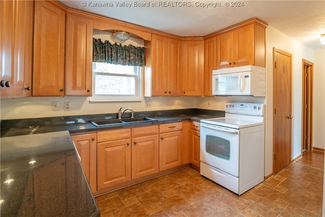 kitchen featuring white appliances and sink