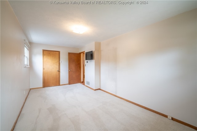 unfurnished bedroom featuring carpet floors