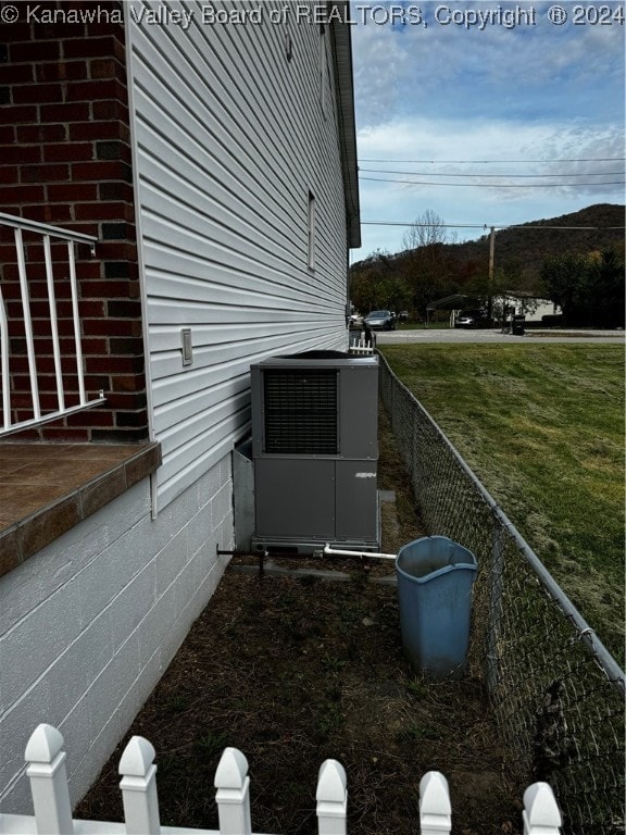 view of side of property with central AC