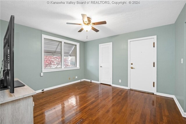 302 Kenna Dr, South Charleston, WV 25309 - unfurnished living room featuring ceiling fan and wood finished floors