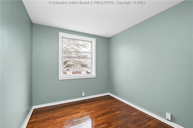 unfurnished room featuring hardwood / wood-style flooring