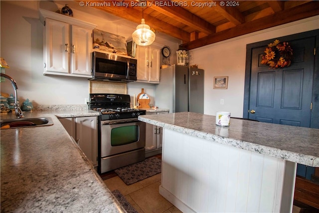 kitchen with stainless steel appliances, sink, wooden ceiling, beamed ceiling, and decorative light fixtures