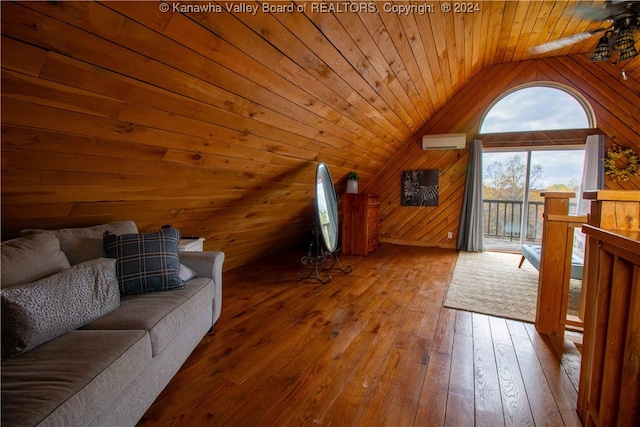 additional living space featuring wood-type flooring, wood walls, a wall mounted air conditioner, lofted ceiling, and wooden ceiling