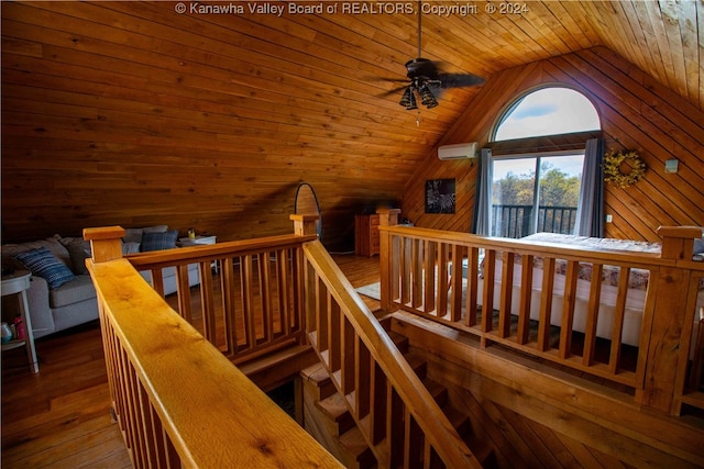 interior space featuring wood walls, lofted ceiling, wood ceiling, and hardwood / wood-style flooring