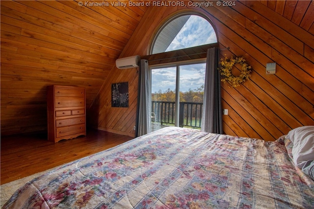 bedroom with a wall mounted AC, access to exterior, wooden walls, hardwood / wood-style flooring, and wooden ceiling