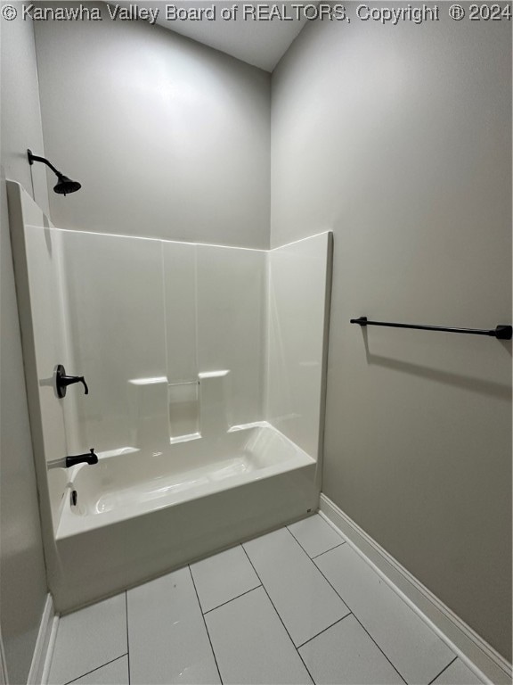 bathroom featuring tile patterned floors and shower / washtub combination