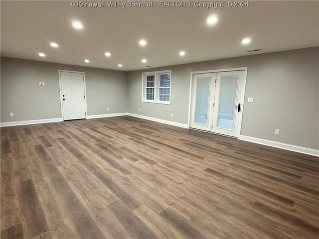 spare room featuring dark wood-type flooring