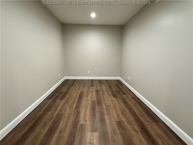 spare room featuring dark hardwood / wood-style flooring