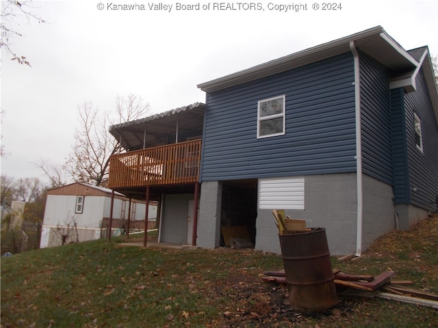 back of house featuring a deck