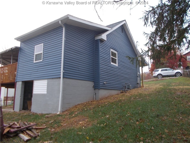 view of side of home featuring a yard