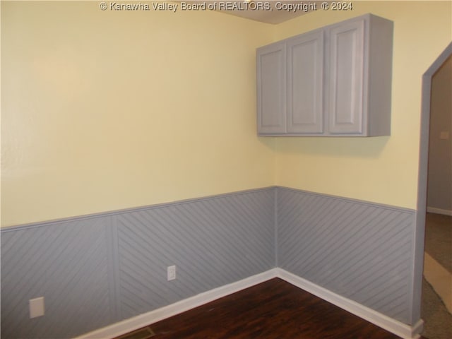 unfurnished room featuring dark hardwood / wood-style floors