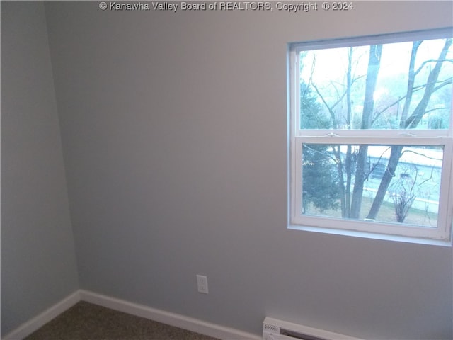 spare room with a baseboard radiator