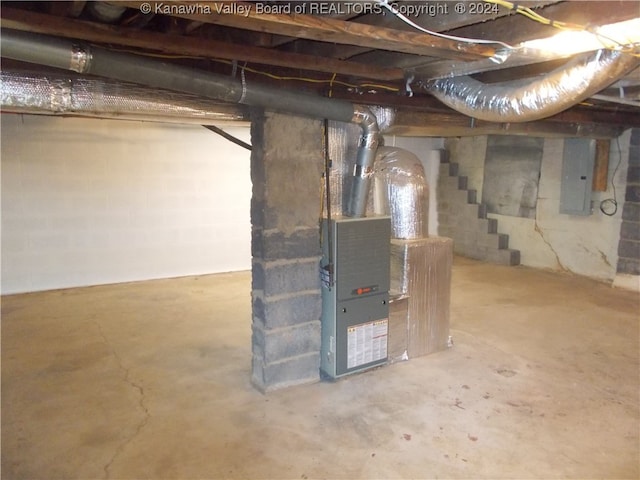 basement with electric panel and heating unit