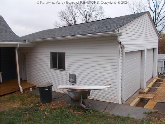 view of side of property featuring a garage