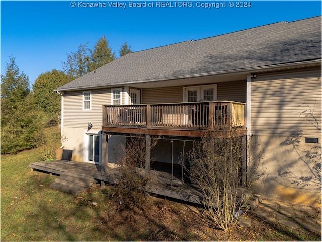 rear view of house featuring a deck