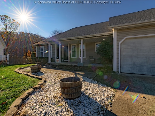 exterior space featuring a garage and a porch