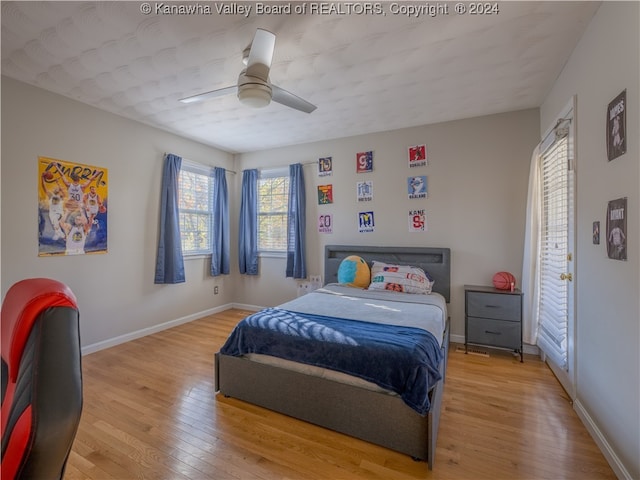 bedroom featuring hardwood / wood-style floors and ceiling fan