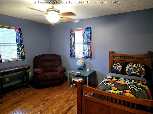 bedroom featuring ceiling fan and hardwood / wood-style floors