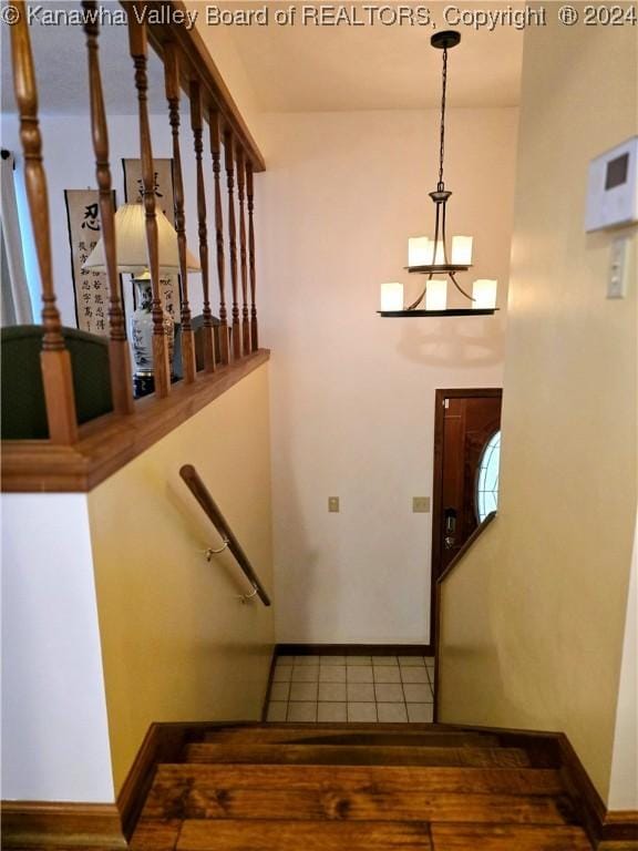 stairway featuring tile patterned floors