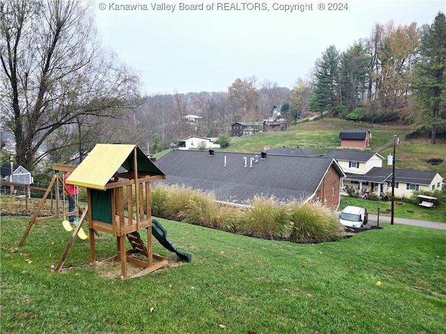 view of playground featuring a yard