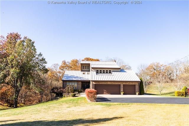 view of front facade with a front lawn and a garage