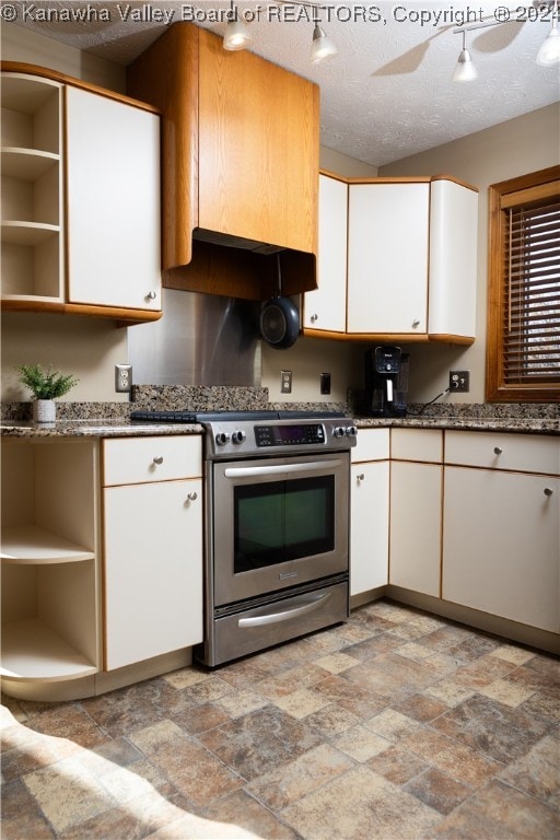 kitchen with stainless steel range, a textured ceiling, extractor fan, ceiling fan, and white cabinets