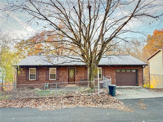 single story home with a garage