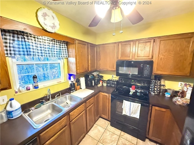 kitchen featuring black appliances, sink, light tile patterned floors, and ceiling fan