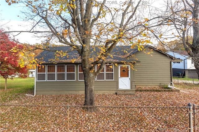 view of front of property with a sunroom