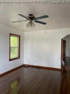 unfurnished room with ceiling fan and wood-type flooring