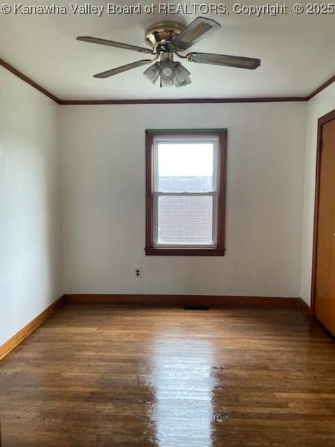 empty room featuring hardwood / wood-style floors, ceiling fan, and crown molding