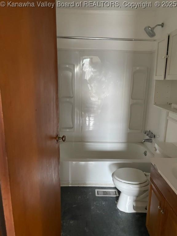 full bathroom with vanity, toilet, and shower / bathtub combination